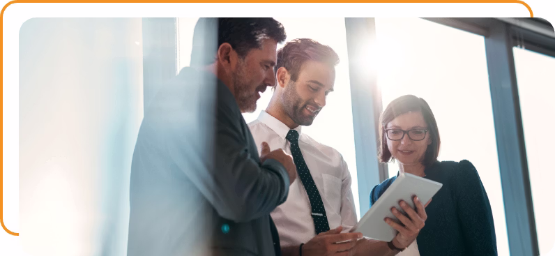 Three business people discussing a proposal